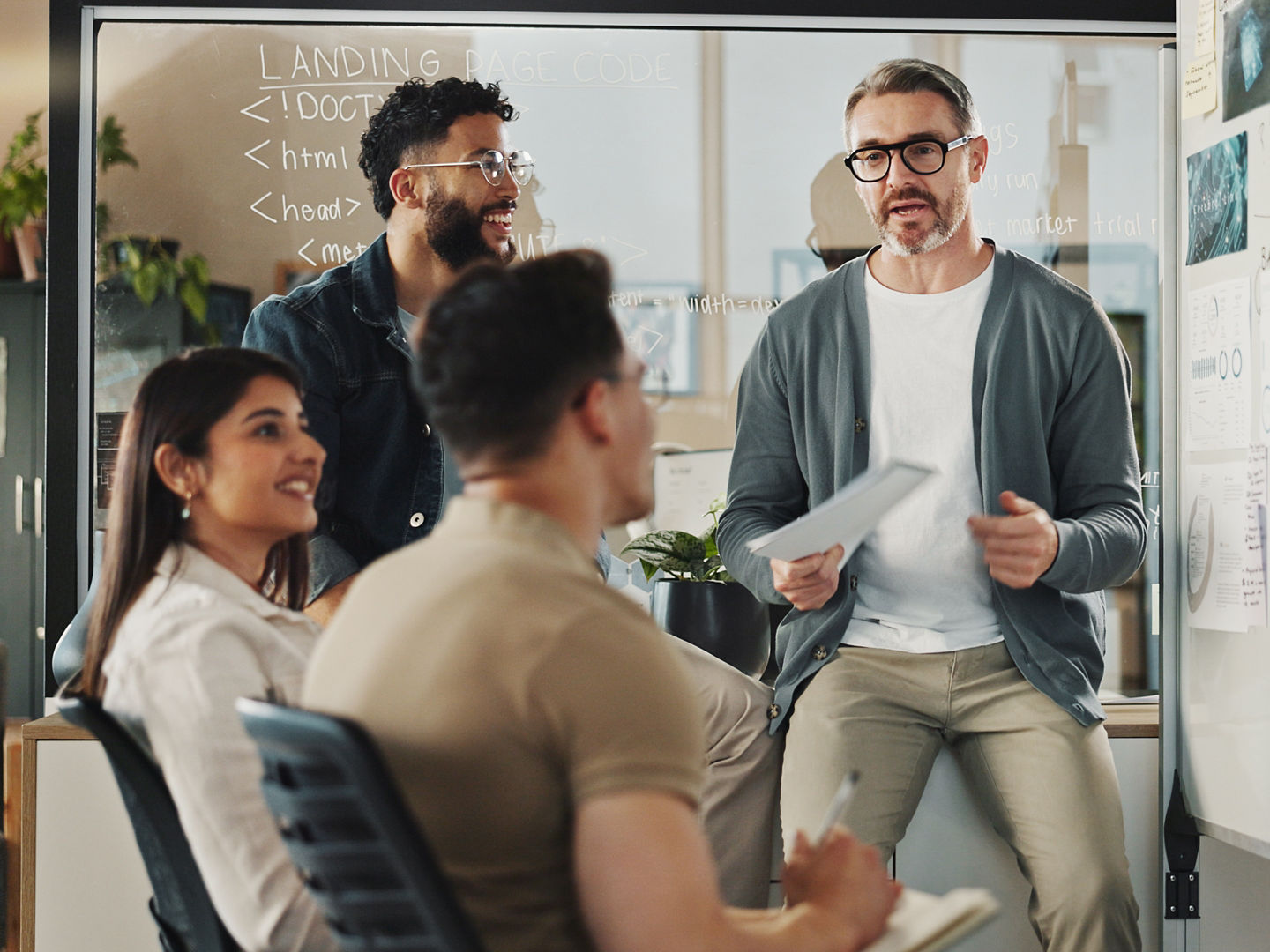 Meeting, web development and whiteboard with business people in office for feedback or review. Data, graphs and statistics with creative employee group in workplace for planning, strategy or vision.