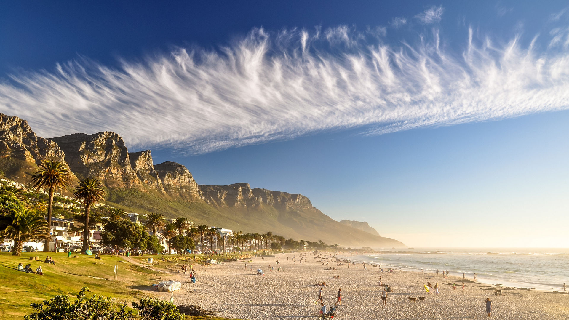 Stunning evening photo of Camps Bay, an affluent suburb of Cape Town, Western Cape, South Africa. With its white beach, Camps Bay attracts a large number of foreign visitors as well as South Africans., Stunning evening photo of Camps Bay, an affluent suburb of Cape 