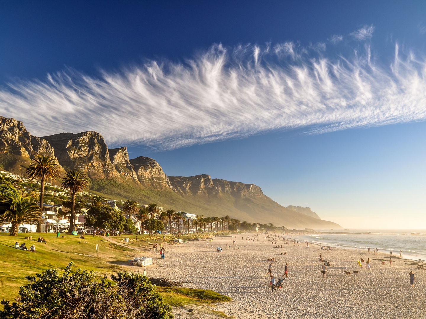 Stunning evening photo of Camps Bay, an affluent suburb of Cape Town, Western Cape, South Africa. With its white beach, Camps Bay attracts a large number of foreign visitors as well as South Africans., Stunning evening photo of Camps Bay, an affluent suburb of Cape 