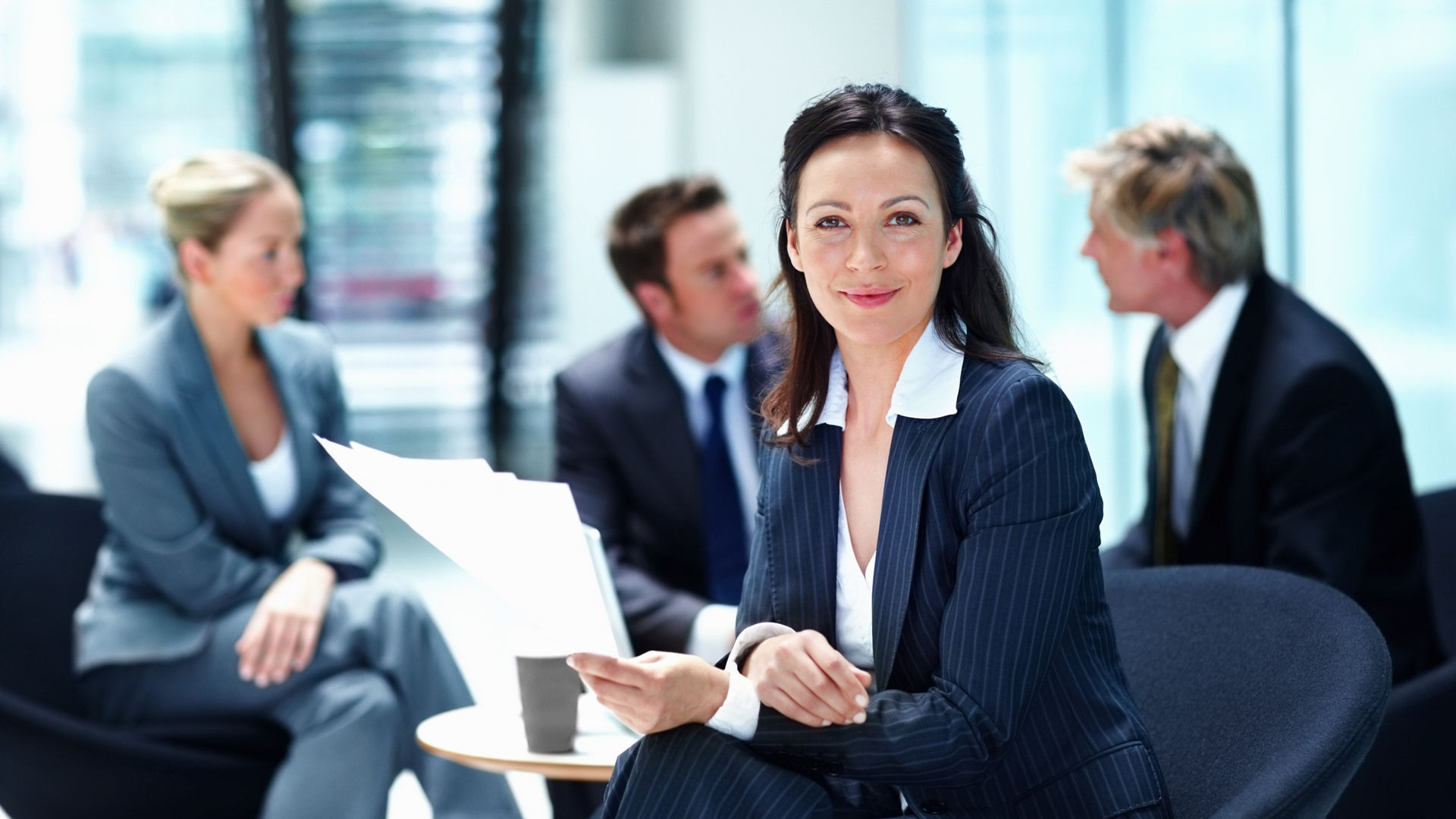 Portrait, meeting or businesswoman with documents or legal team for court case, research or support. Confident, paperwork or lawyers in office with attorney or advisor at law firm for feedback review.