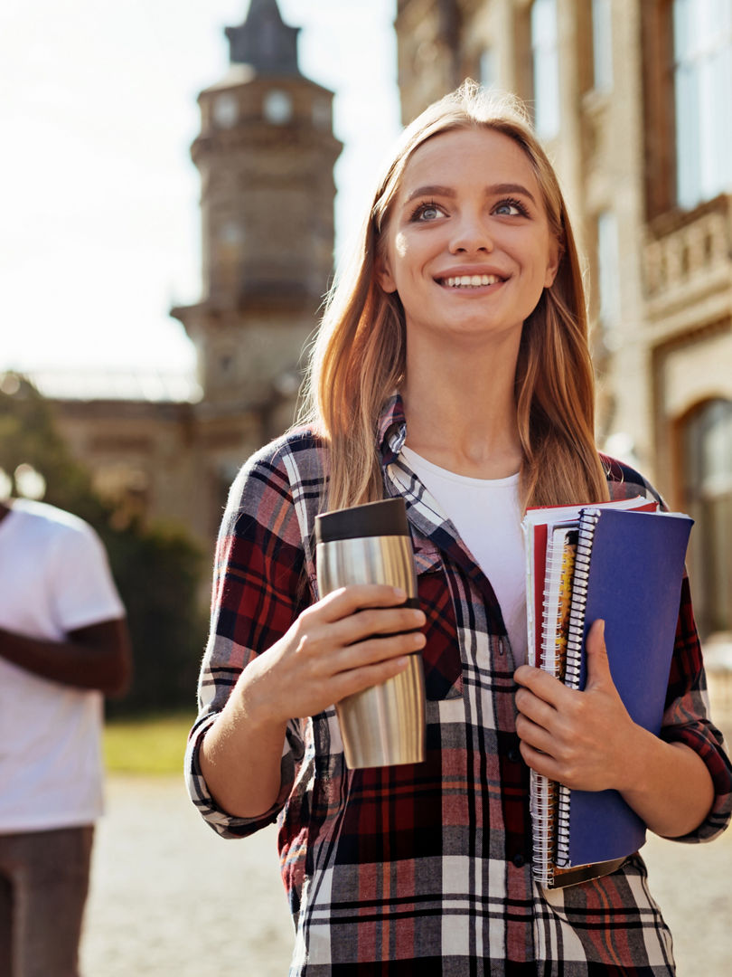 Jolly freshman. Dedicated diligent vibrant girl heading to the class while attending university and being excited