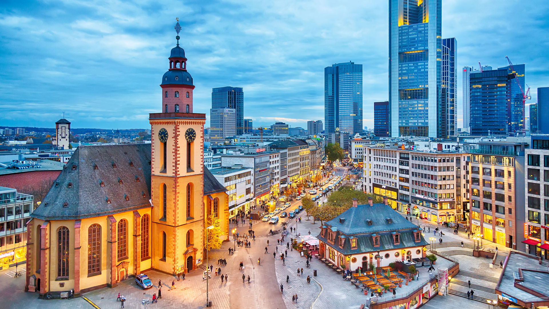 FRANKFURT, GERMANY - NOVEMBER, 2017: View to skyline of Frankfurt in sunset blue hour. St Paul's Church and the Hauptwache Main Guard building at Frankfurt central street Zeil