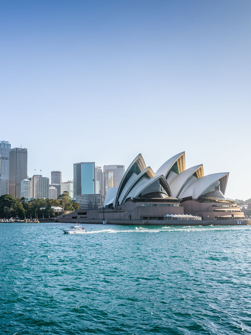  Beautiful sunny coast view to the Skyline and famous Opera House on bright warm day, cruising by ferry from harbour quay bridge to Manly City, Opera House and Quay,Sydney, NSW/ Australia – 10 12 2017,  Beautiful sunny coast view to the Skyline and famous Opera Hous