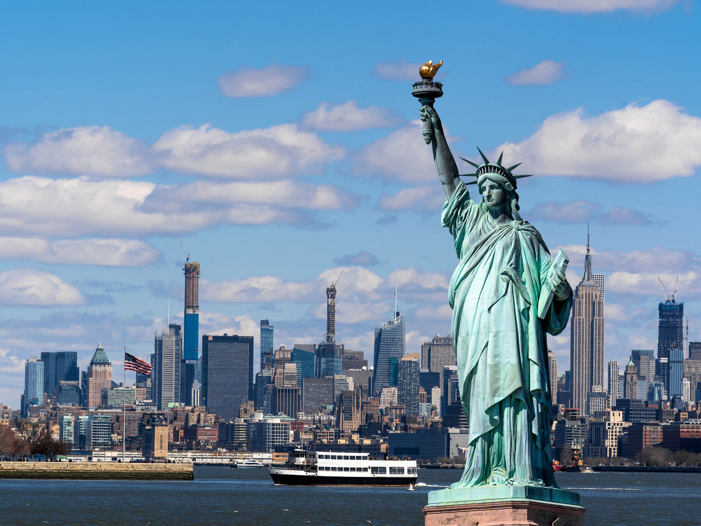 The Statue of Liberty over the Scene of New york cityscape river side which location is lower manhattan,Architecture and building with tourist concept