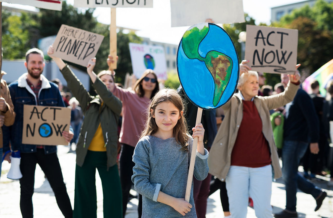 People with placards and posters on a global strike for climate change.