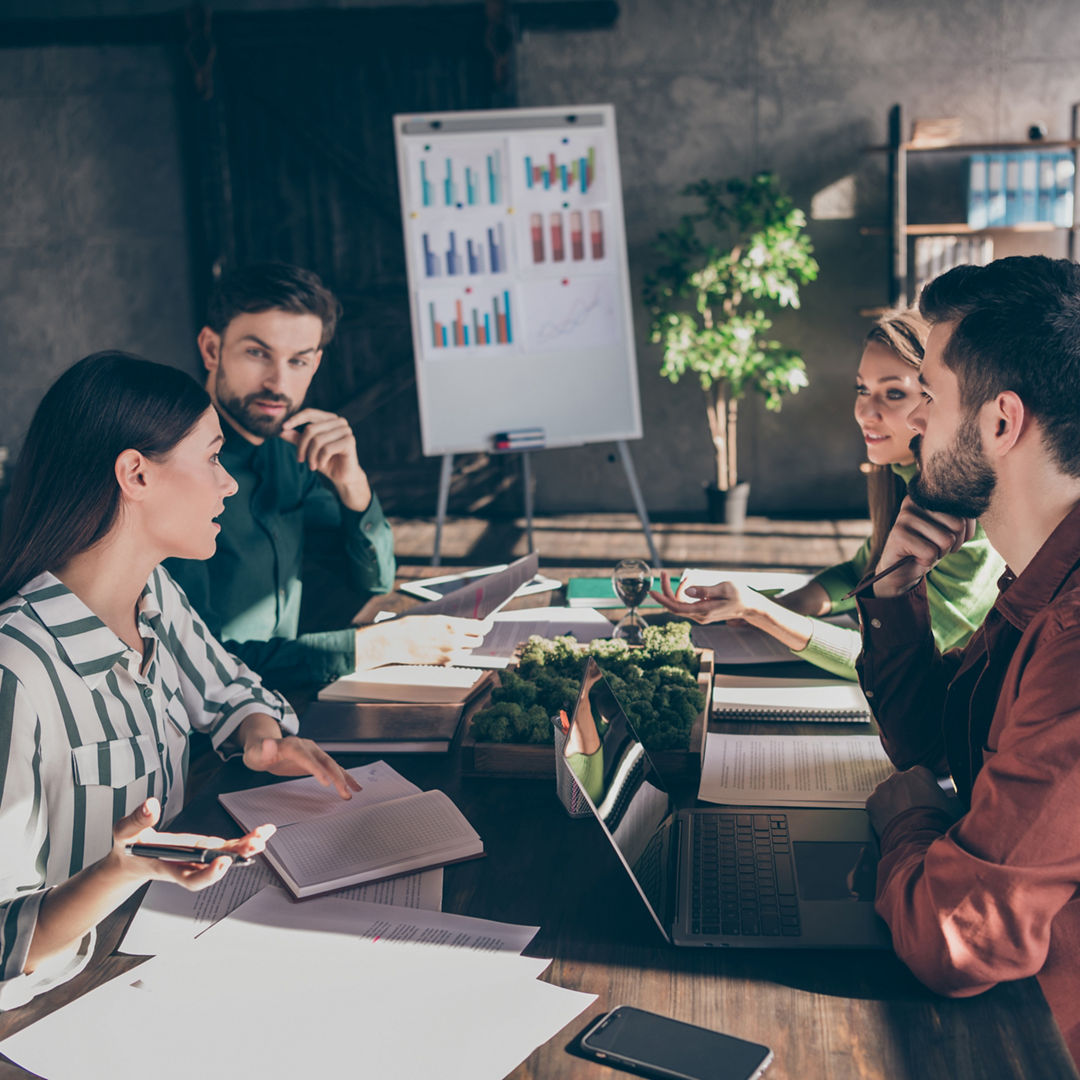 Skilled smart clever businesspeople specialists sharks experts company, owners ceo boss chief gathering talking about progress at modern industrial loft style interior work place station indoors