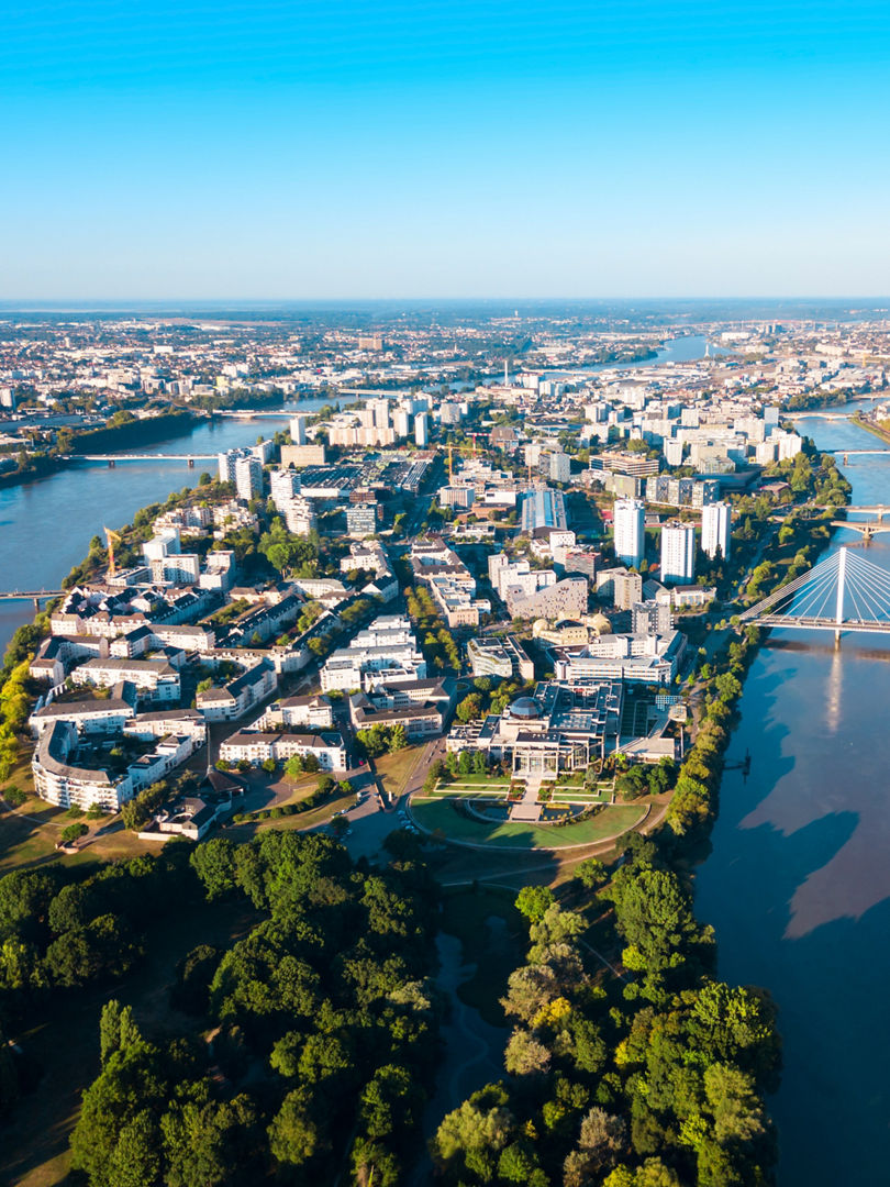 Nantes city between the branches of the Loire river aerial view in Loire-Atlantique region in France