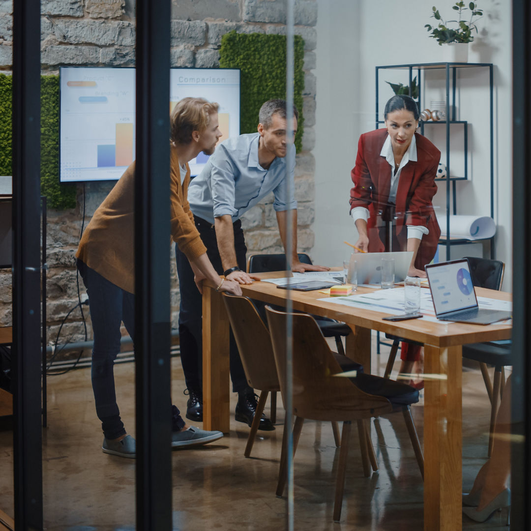 Diverse Group of Professional Businesspeople Meeting in the Conference Room. Stylish Busy Business Office with Creative People Working on App Design, Data Analysis, Plan Strategy for Social Media, Diverse Group of Professional Businesspeople Meeting in the Conf
