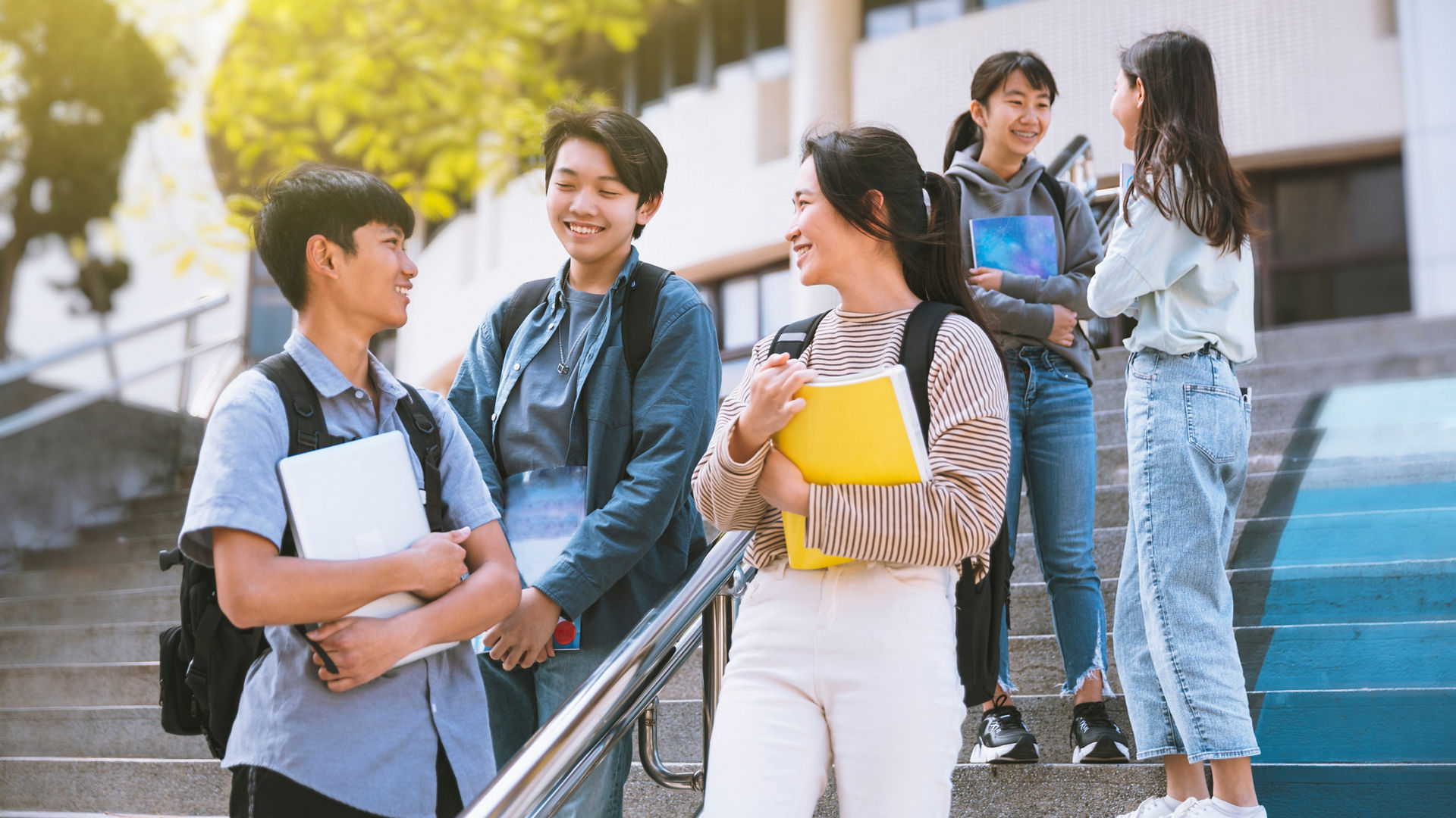 Happy Teenager Students talking and Walking On Stairs 