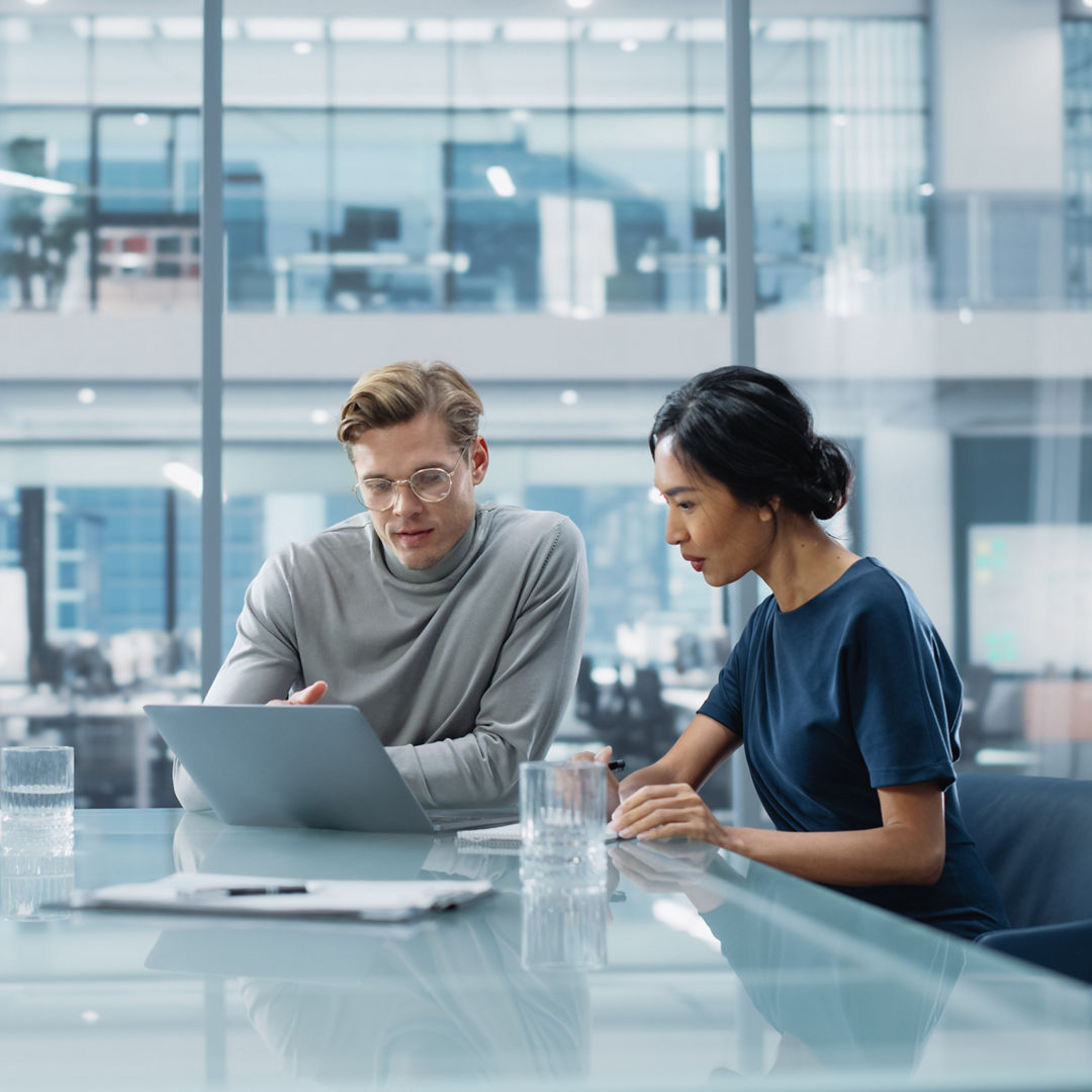 Multiethnic Diverse Office Conference Room Meeting: Team of Two Creative Entrepreneurs Talk, Discuss Growth Strategy. Stylish Young Businesspeople work on Investment and Marketing Projects.