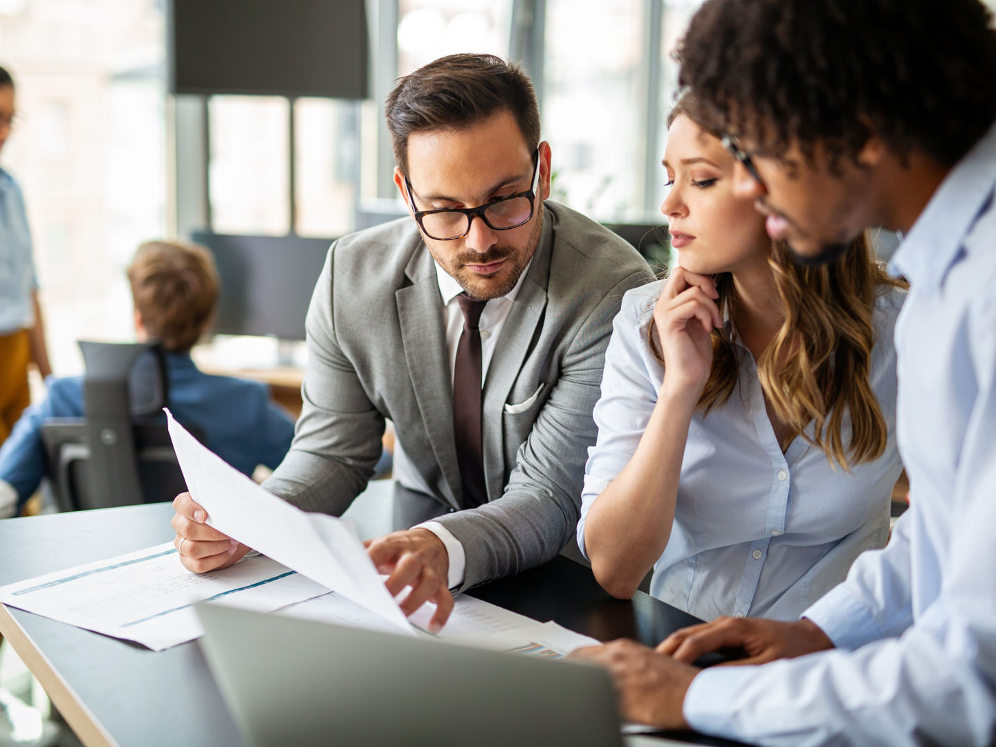 Group of multiethnic business people working together at busy modern office