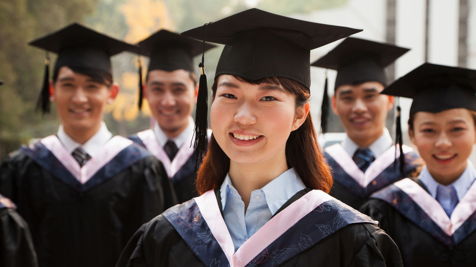 Young Graduates in Cap and Gown