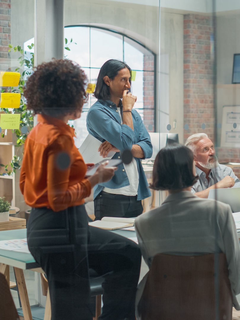 Female Business Coach for Company Management Explains How to Train your Team Efficiently in a Workshop Inside Creative Office. Woman Trainer Writing on Whiteboard and Training Interactive Employees, Female Business Coach for Company Management Explains How to Tra
