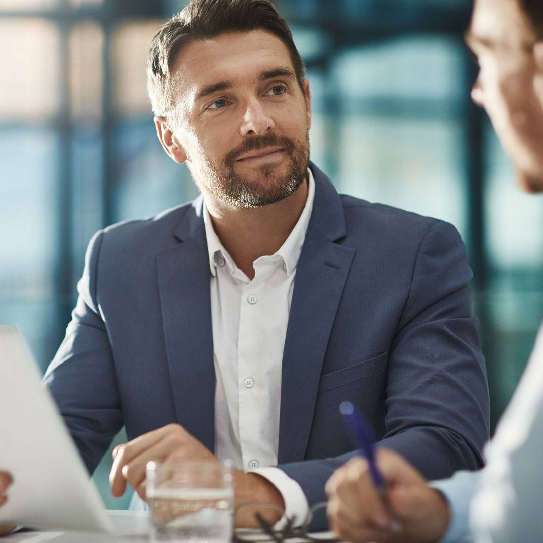 Tablet, teamwork and business people in meeting in office workplace. Collaboration, digital technology and men or workers with touchscreen planning sales, analysis or strategy in company.