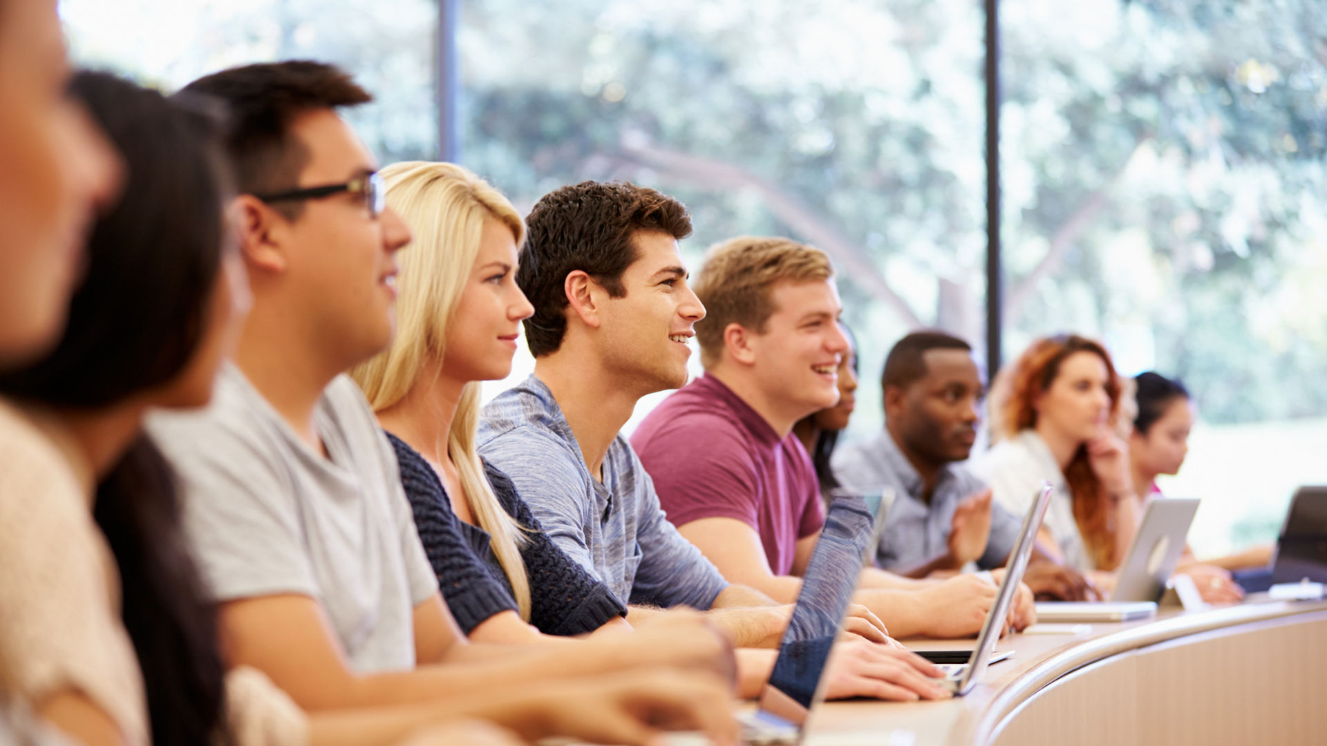 Class Of University Students Using Laptops In Lecture