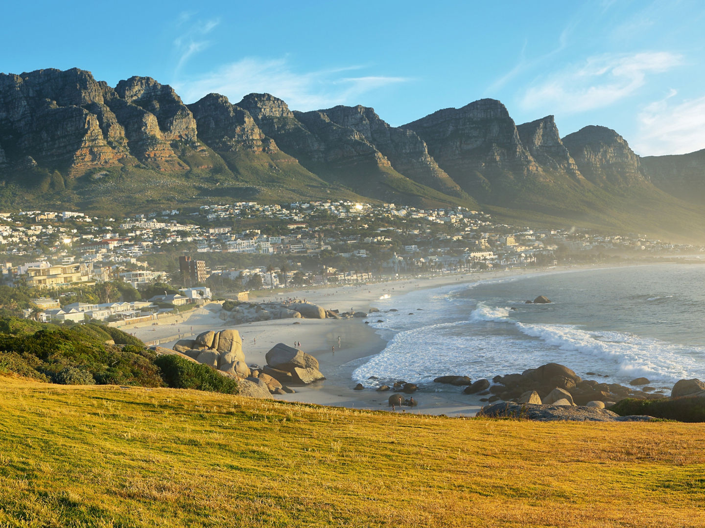 Camps Bay Beach in Cape Town, South Africa, with the Twelve Apostles in the background.