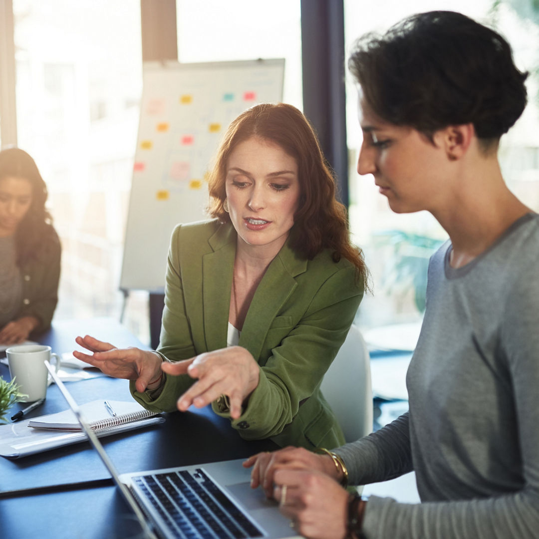 Boardroom, mentor and business people with laptop for discussion, research and access to company page. Office, web designer and manager in creative agency with digital for startup, progress or review.