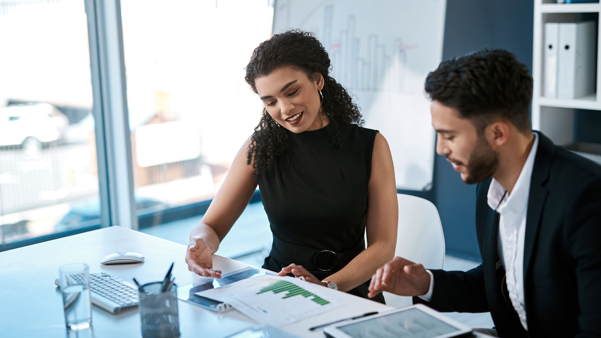 Data analysis, woman and man with tablet, report or budget review statistics for business growth. Proposal, planning and teamwork in sales development, consultant and financial advisor in partnership.