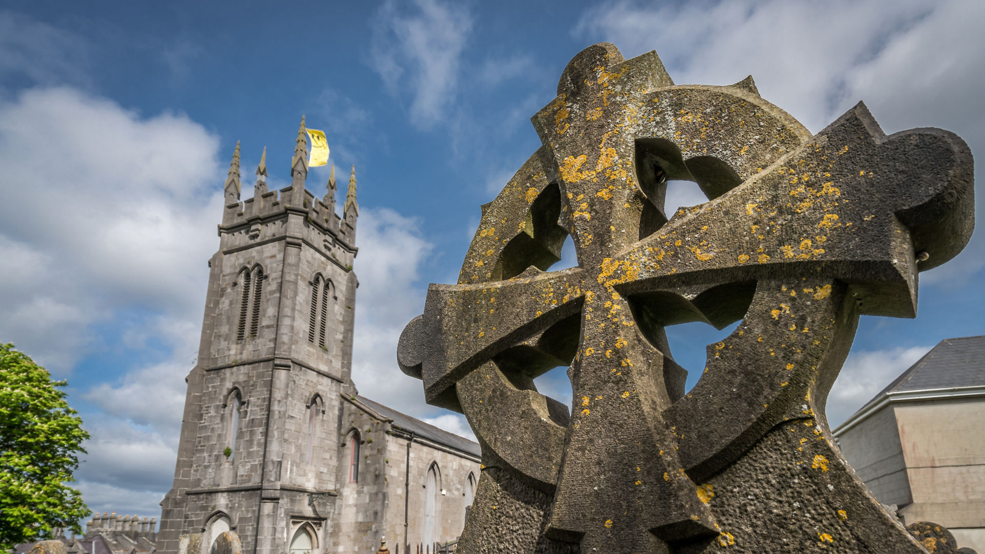 Celtic cross on a tomb in a cemetery in Limerick, Ireland