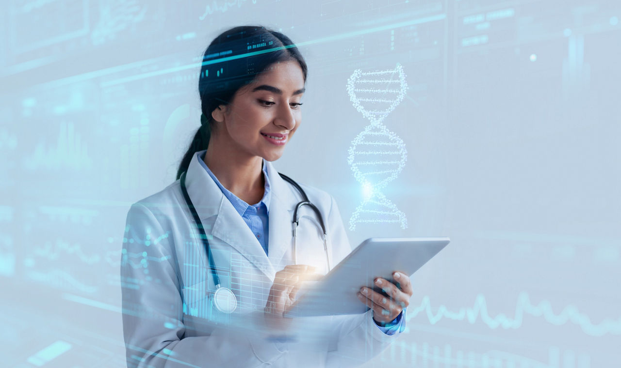 CRISPR technology. Young advanced indian lady doctor enjoying futuristic medical technologies, studying virtual human DNA strand on digital tablet, blue studio background